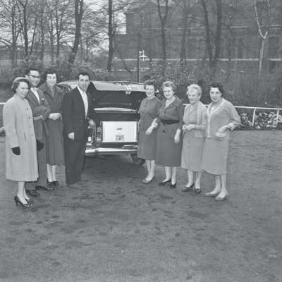 Portrait of a group with car
