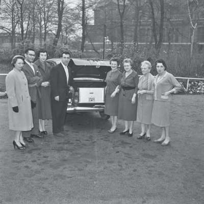 Portrait of a group with car