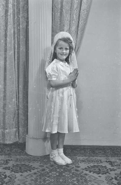 Portrait of a girl in Holy Communion dress