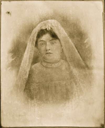 Portrait of a woman in headress