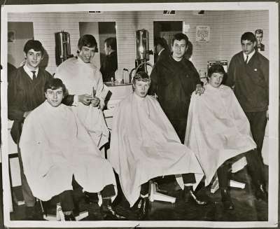 Portrait of young men in barber shop