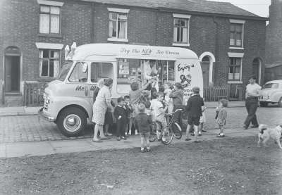 Group around Mr Whippy Ice Cream Van with dog