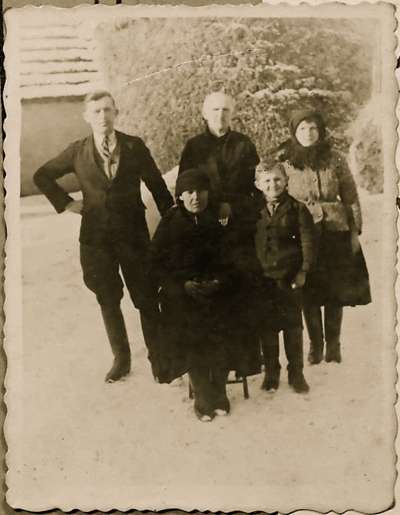 Copy photograph of family group in snow