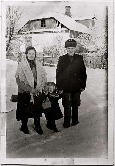 Man, woman and child in the snow