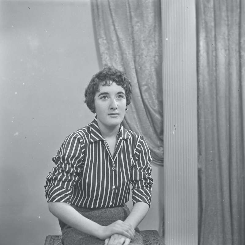 Portrait of a young woman in striped shirt