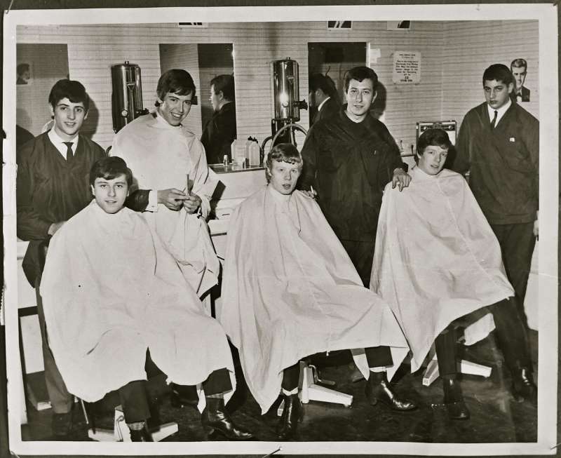 Portrait of young men in barber shop