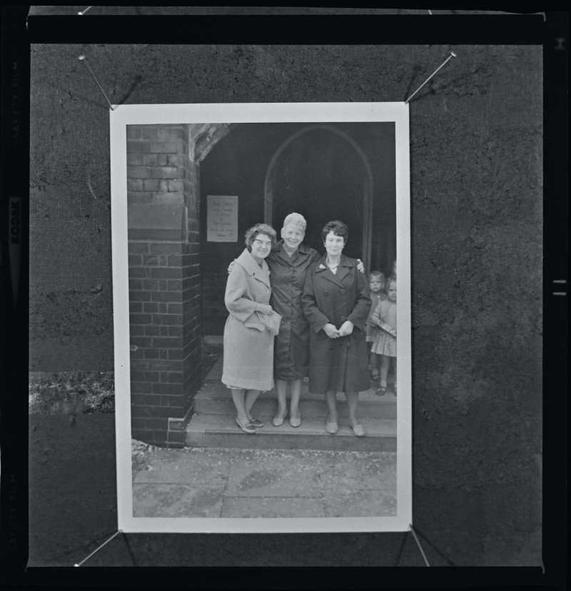 Portrait of three women outside Church, original record