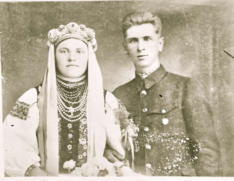 Portrait of a man and woman in traditional dress, man in uniform