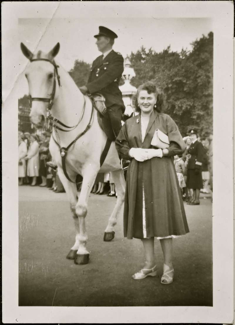 Portrait of woman next to horse