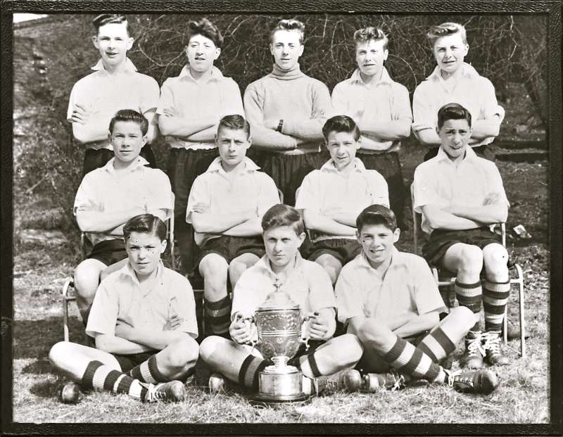 Group of boys holding cup